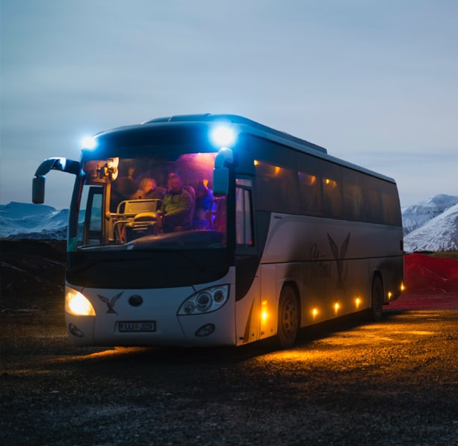 Comfortable tour bus traveling to snow-covered Mt Buller for a winter adventure